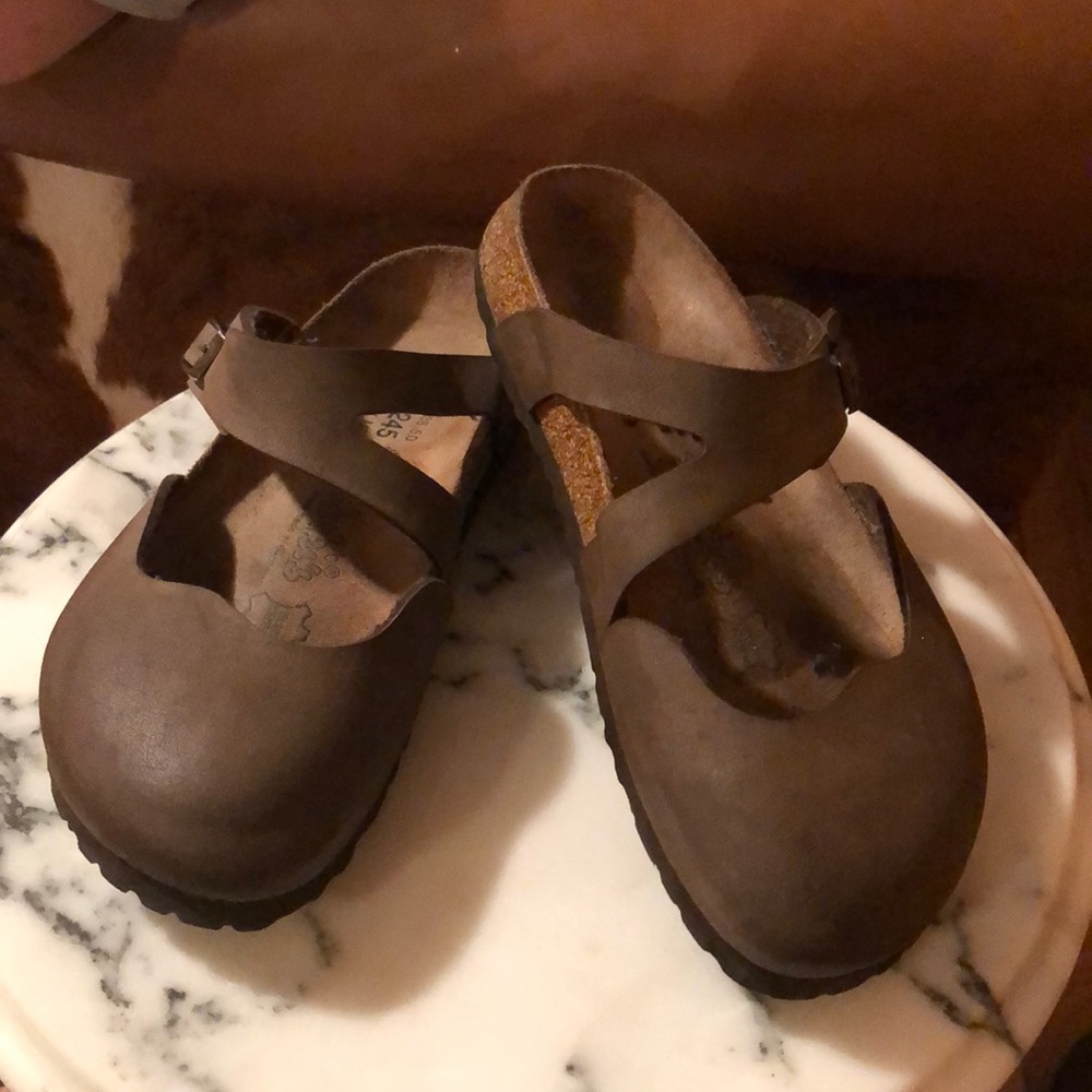 Birkenstock’s Birkis brown slip ons clogs